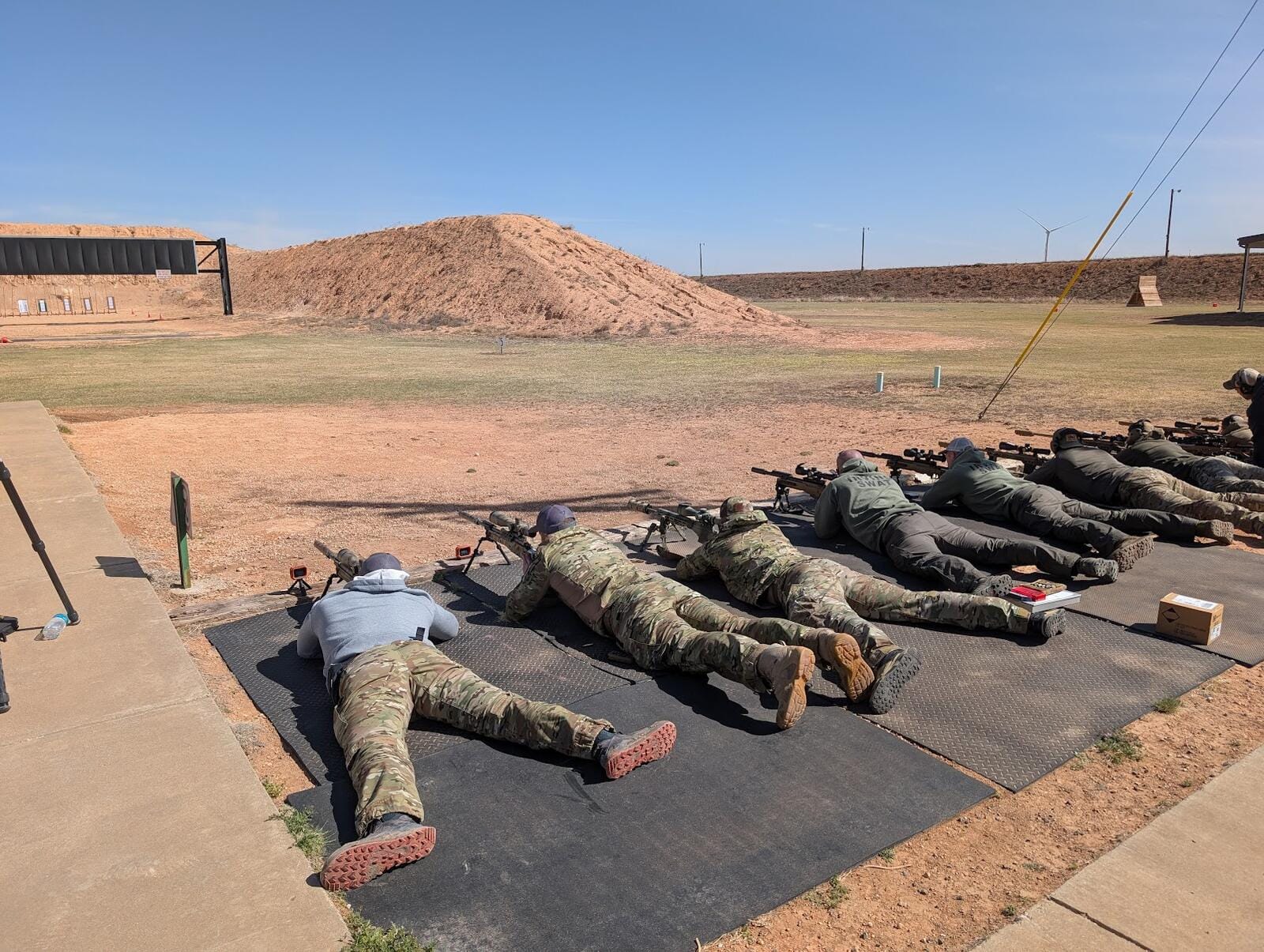 Precision rifle shooters on the line during instruction